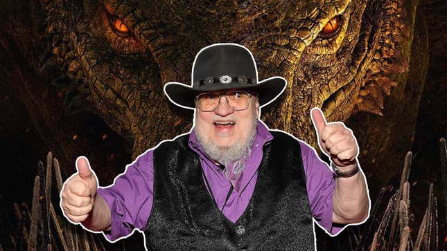 George R.R. Martin stands in front of a dragon with thumbs up.