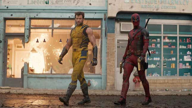 Wolverine and Deadpool walk along a street